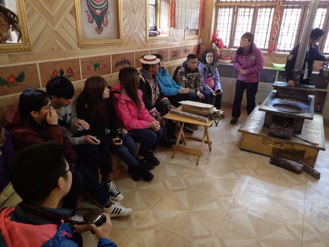 Local villagers of The Baima Tribe making cultural artwork including wooden craft and traditional weaving.